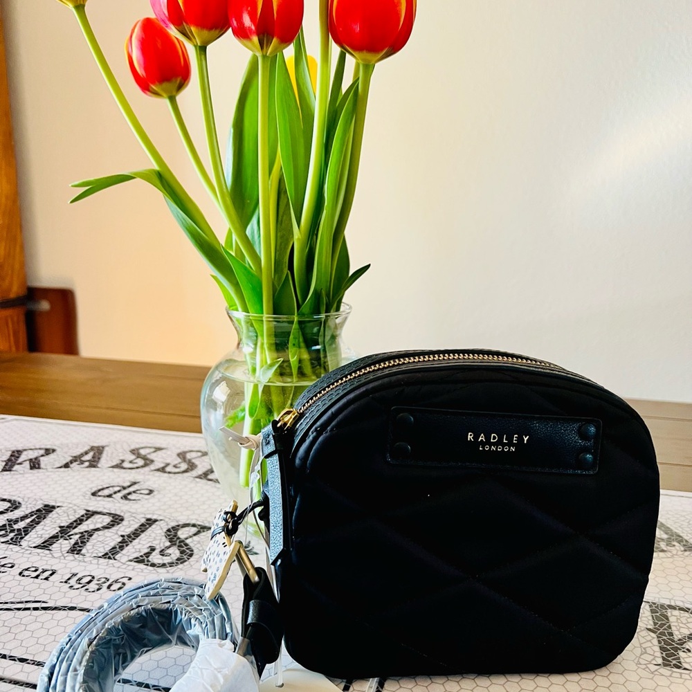 Brand new with tag Radley of London crossbody bag. Black 7 1/2 w x 6 h